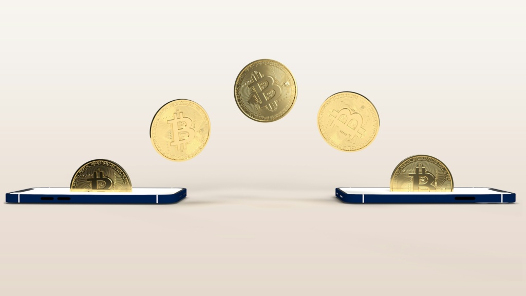 a bunch of coins flying out of a cell phone