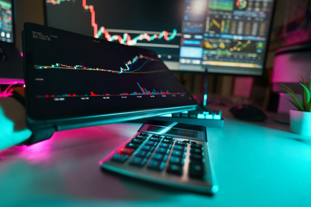 A desk with a keyboard and a monitor