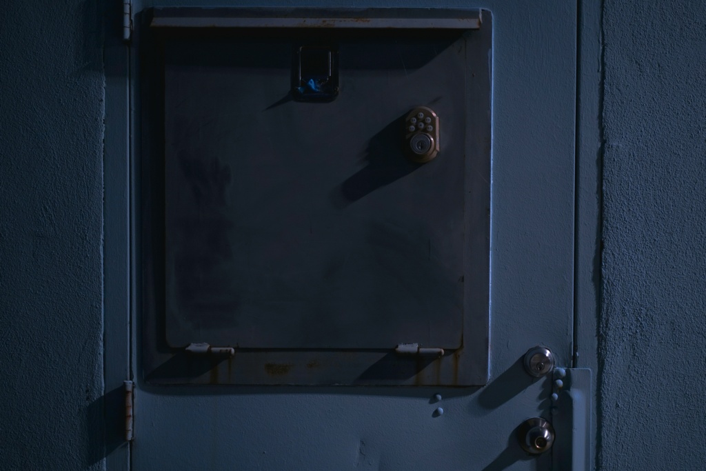 A closed metal door with a lock